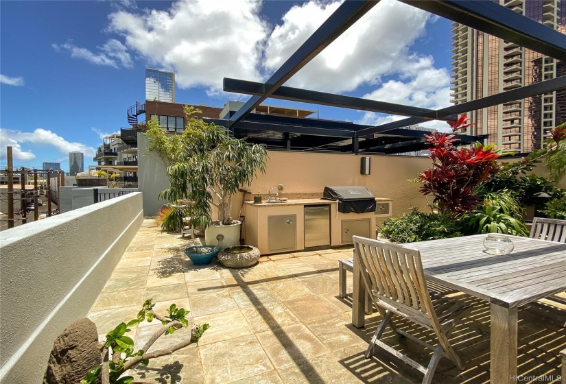 Upstairs lanai area with your own grill and seating area.  Not a common area, but part of your own unit.