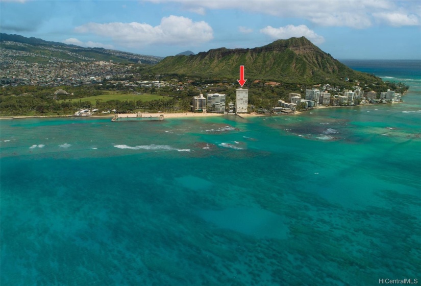 Showing prime location at foot of Diamond Head on sandy beach.