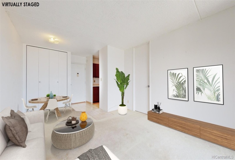 Virtually staged photo.  Looking from Lanai to unit door in the center of the photo.  Large closet to the left of the unit door, kitchen just to the right of the unit door, and bedroom door to the right of the kitchen.