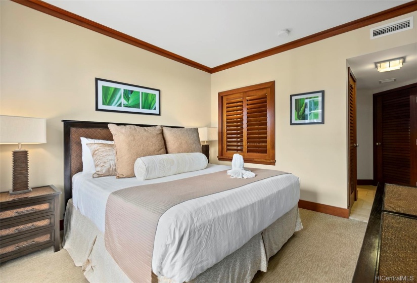 Master bedroom with ocean views, lanai access and en suite bath.