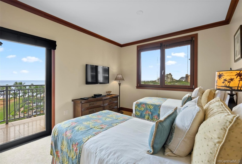 Guest bedroom with two twin beds that can be converted to a king; ocean views w/ private balcony lanai access.