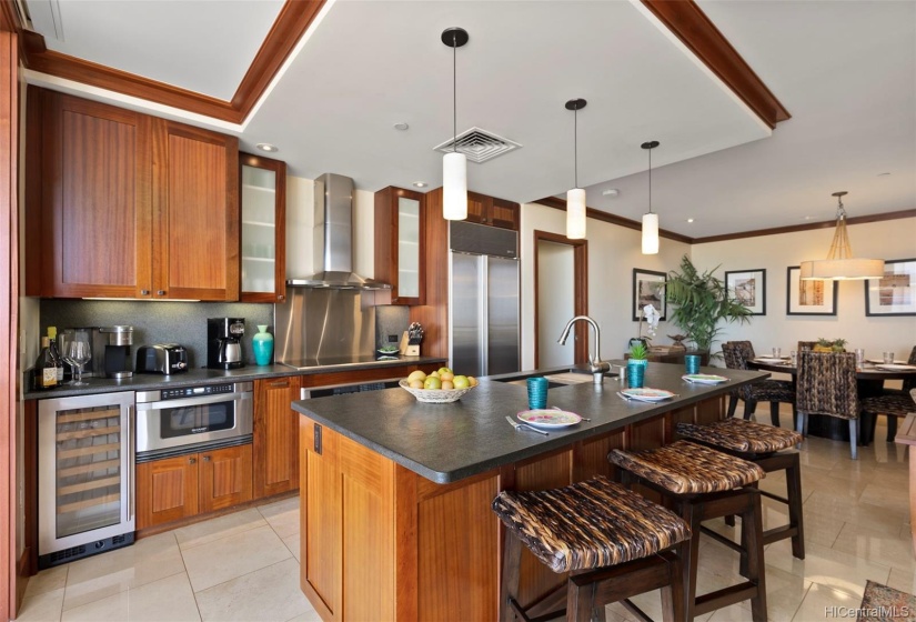 Beautiful mahogany trim and stainless steel appliances compliment the design.