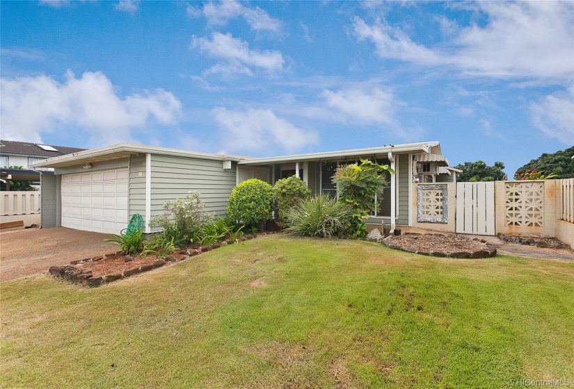 This house has curb appeal! The house has vinyl siding. It's fully fenced in. The landscaped yard is low maintenance and includes automatic water sprinklers. The enclosed garage with automatic garage door opener includes 3 large storage closets.