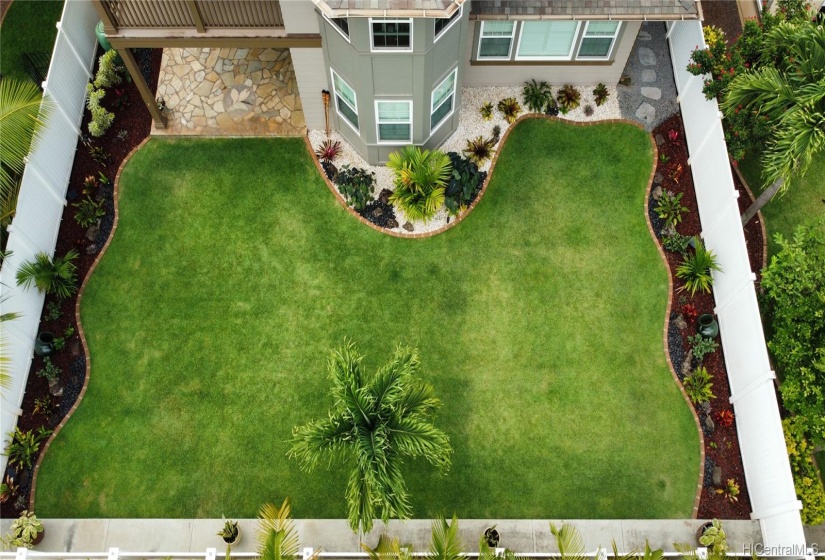 Aerial view of the landscaped backyard. Lot of space for hosting parties and small get togethers or just space for your kids and or pets to run around in.