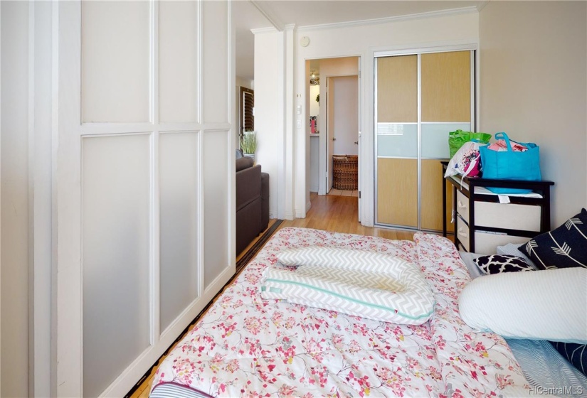 Bedroom features sliding doors which allow for versatility and creative living options.