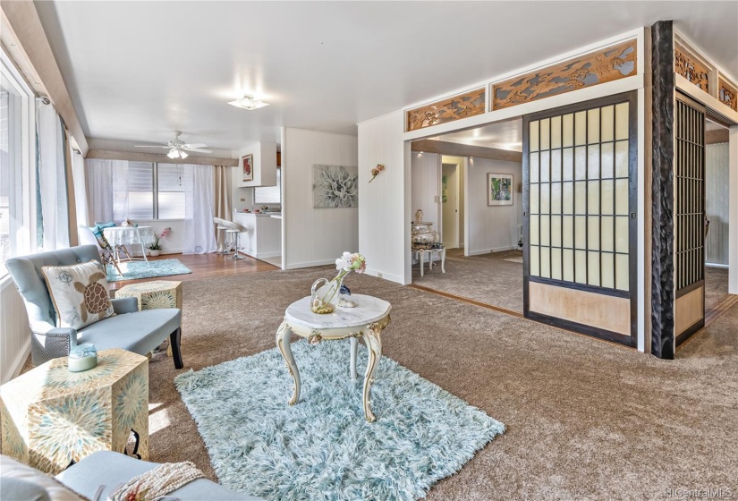 View from living to tea/library/play room and dinning room.