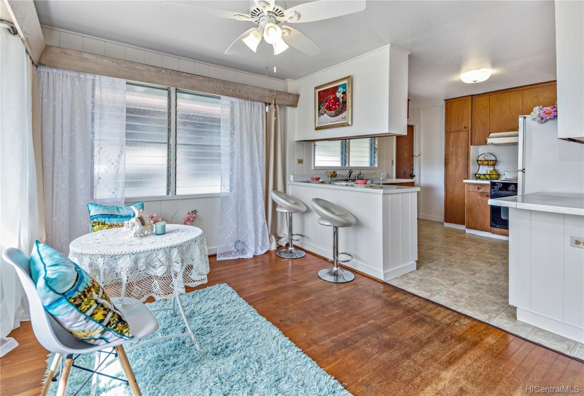 View of Dinning area to Eating or Drinking Nook and Kitchen.