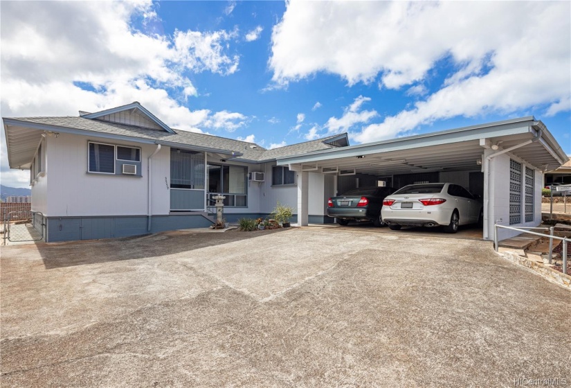 The covered two car carport area includes an additional  storage area, Washer/Dryer/Water and one toilet for yard work or party .