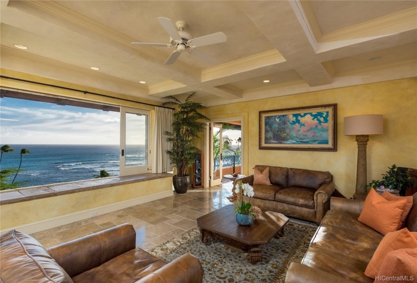 Over-sized pocket windows vanish into the walls,  bringing the sights and sounds of the ocean and all it's beauty inside.