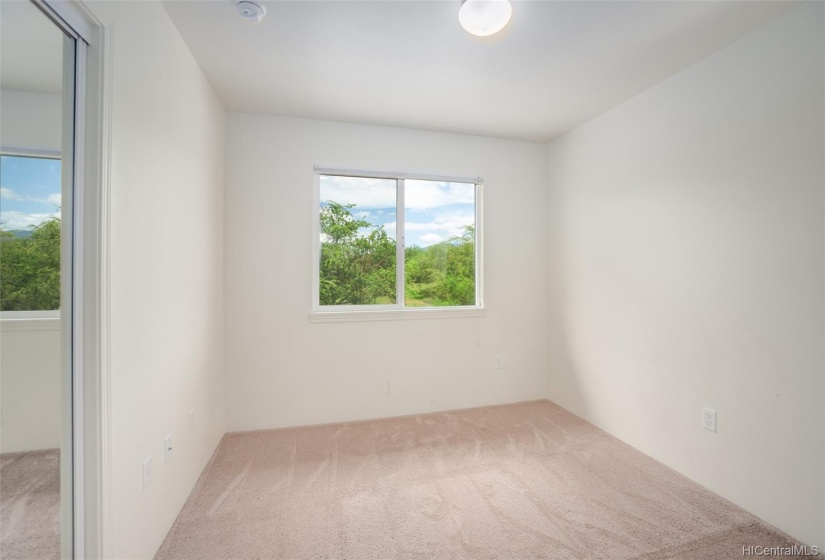 One of the upstairs bedrooms with views of the golf course!