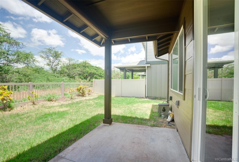 Covered patio to enjoy the breeze and golf course views.