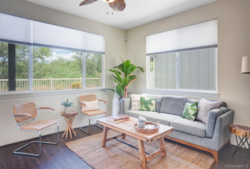 Private living room space with windows overlooking golfcourse.