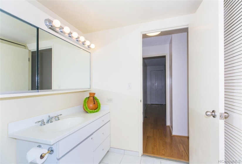 2nd bathroom also has a large cabinet with sliding mirrored doors