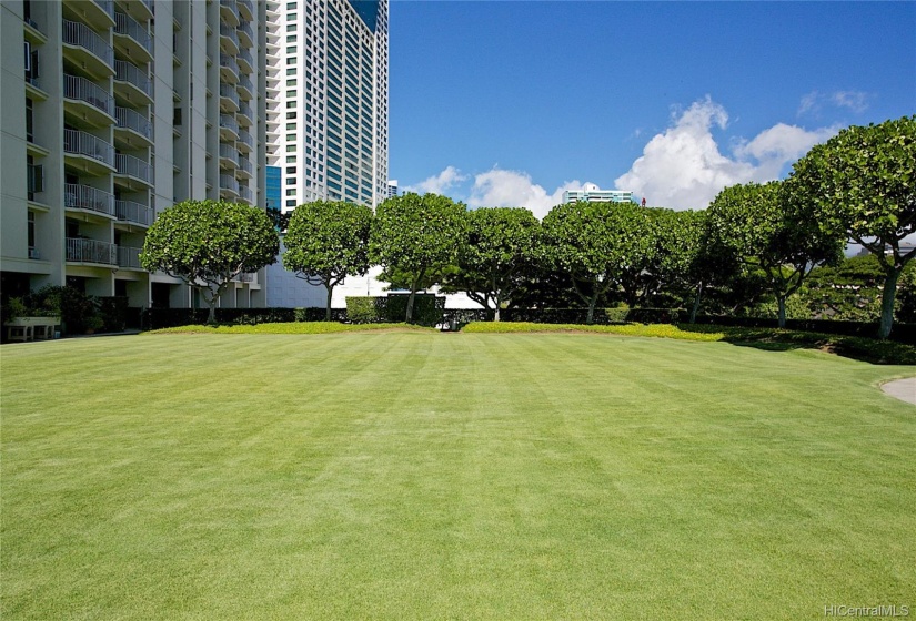 Acres of greenery with walking paths around the spacious grounds