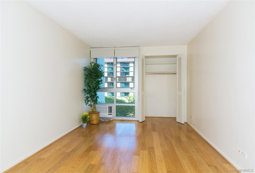 Master bedroom has 2 closets,  brand new windows and solar shades,  new AC, & oak flooring throughout.