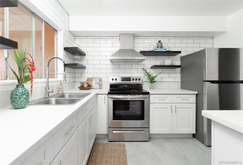 Newly remodeled kitchen has lots of counter space and natural light.