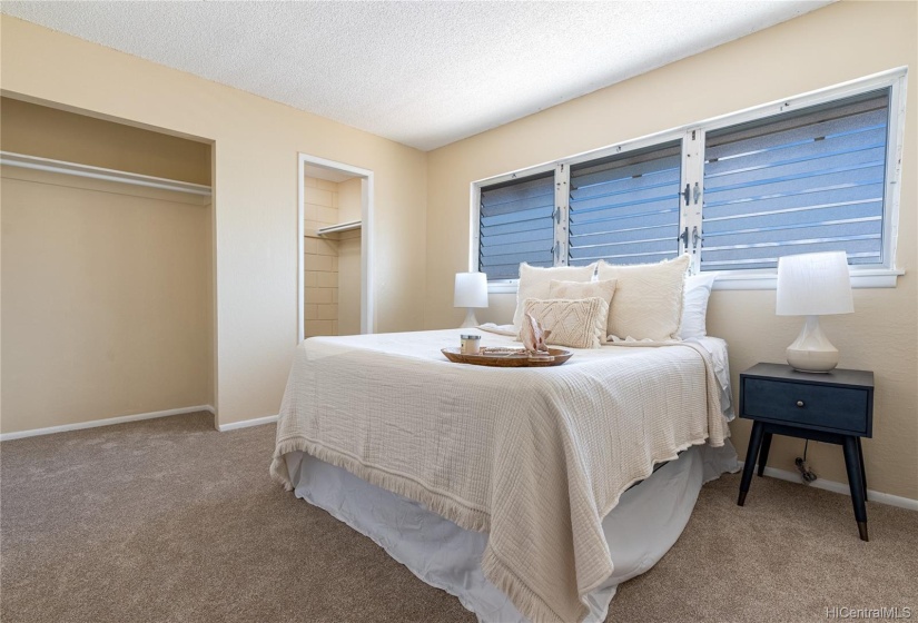 Master bedroom offers lots of storage space.