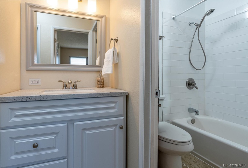 Brand new bathroom vanity and new title flooring.