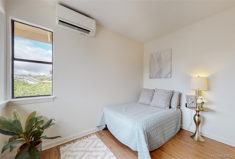 This upstairs bedroom features a brand new split A/C