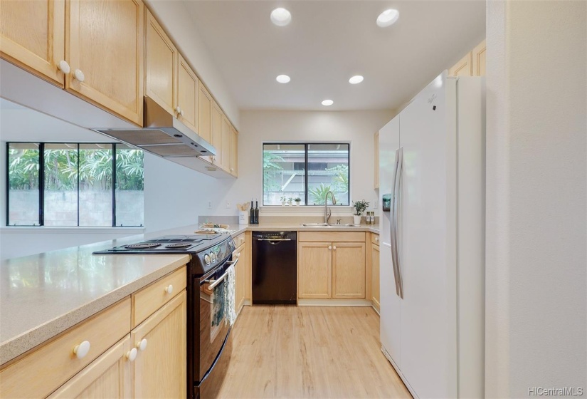 The kitchen features tons of cabinet space to store everything you need to prepare your favorite meals