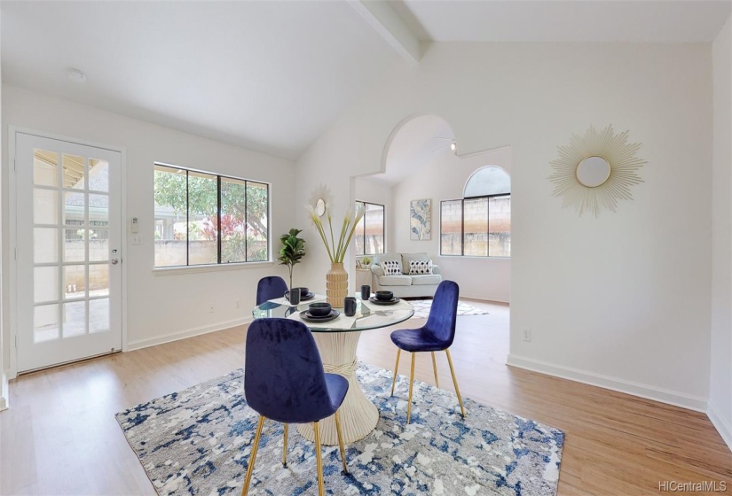 The second living area boasts another open concept room with vaulted ceilings and an additional extension that creates flexibility