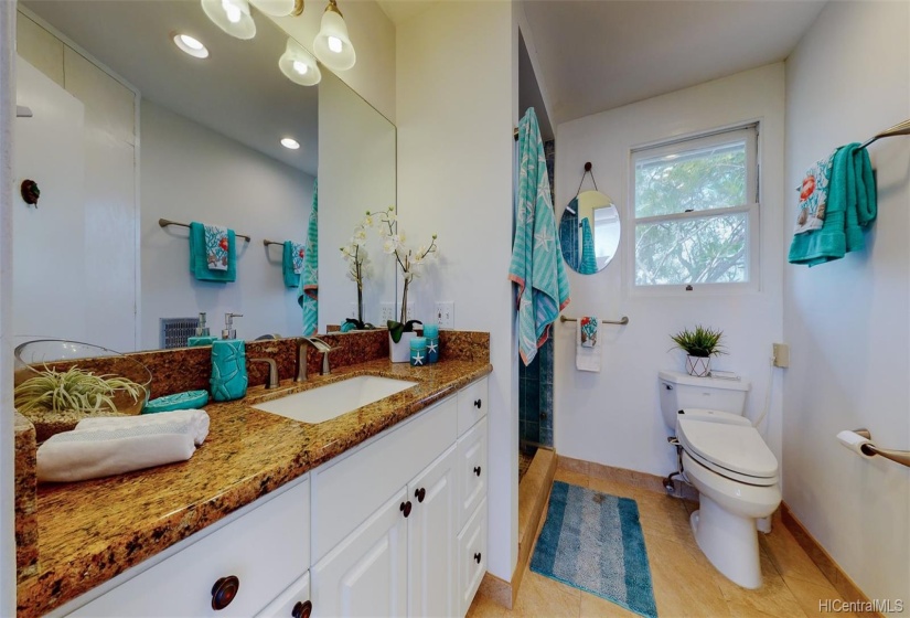 You'll appreciate the renovated bathroom with a large walk-in shower, Toto toilet, granite countertops, & travertine floors!