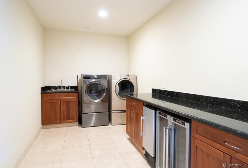 Wine cooler, laundry and pantry.