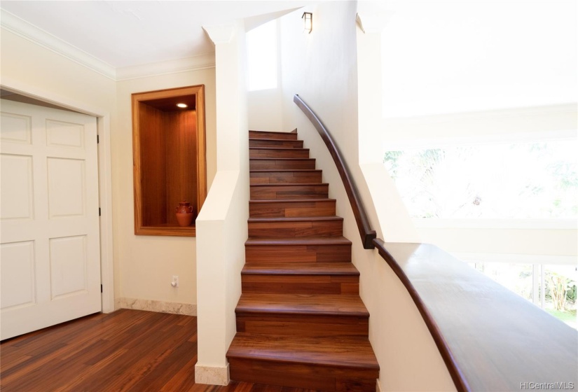 Winding staircase to the rooftop viewing deck.