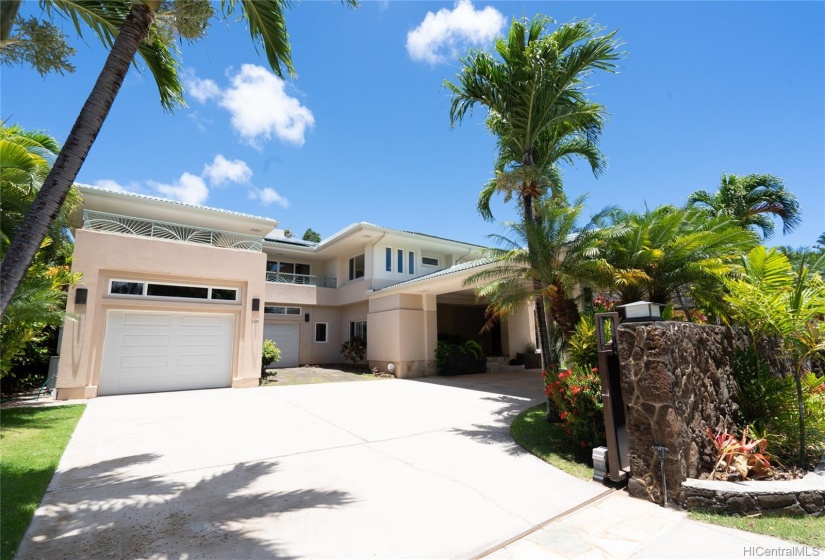 Circular driveway, expansive garage.