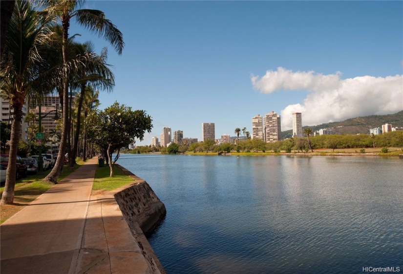 Enjoy strolling on the boardwalk along the Ala Wai Canal.