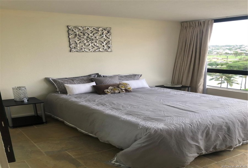 Master bedroom with golf course and canal view.