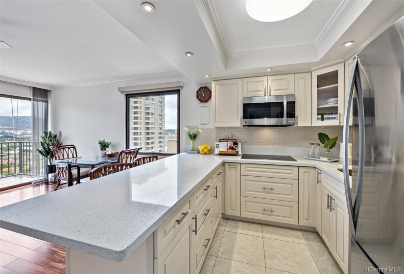 Stainless steel appliances with large open kitchen counter