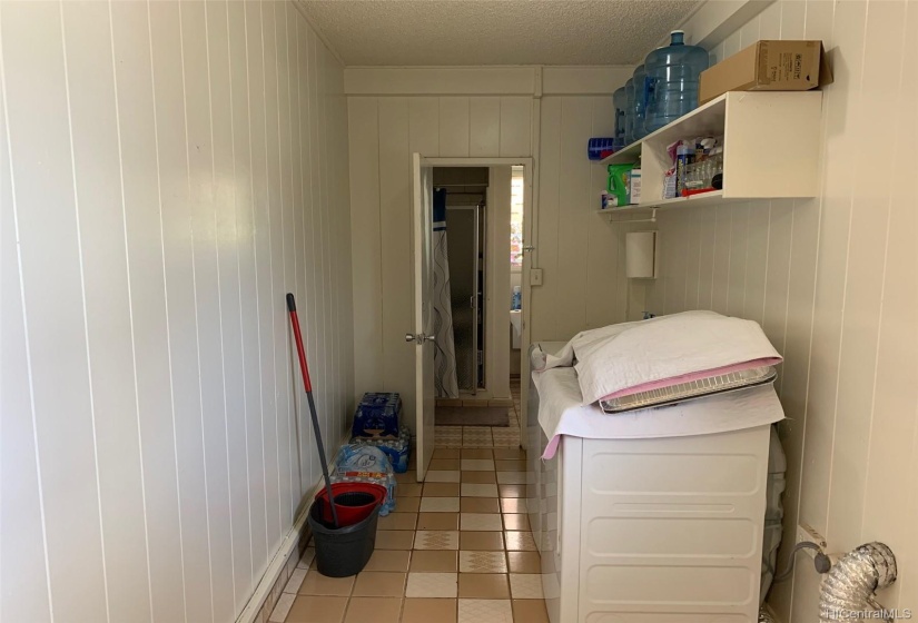 Laundry Room leading to 3 bathroom for guests