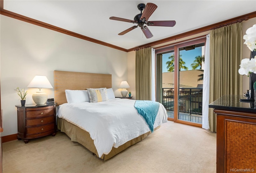 Master bedroom with ceiling fan, central AC, lanai access and en suite bath