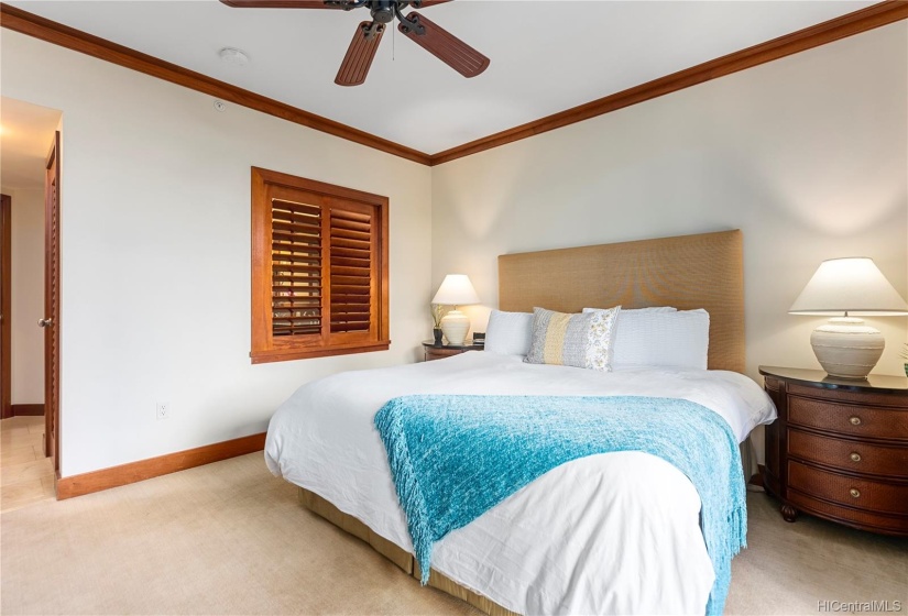 Master bedroom with ceiling fan, central AC, lanai access and en suite bath