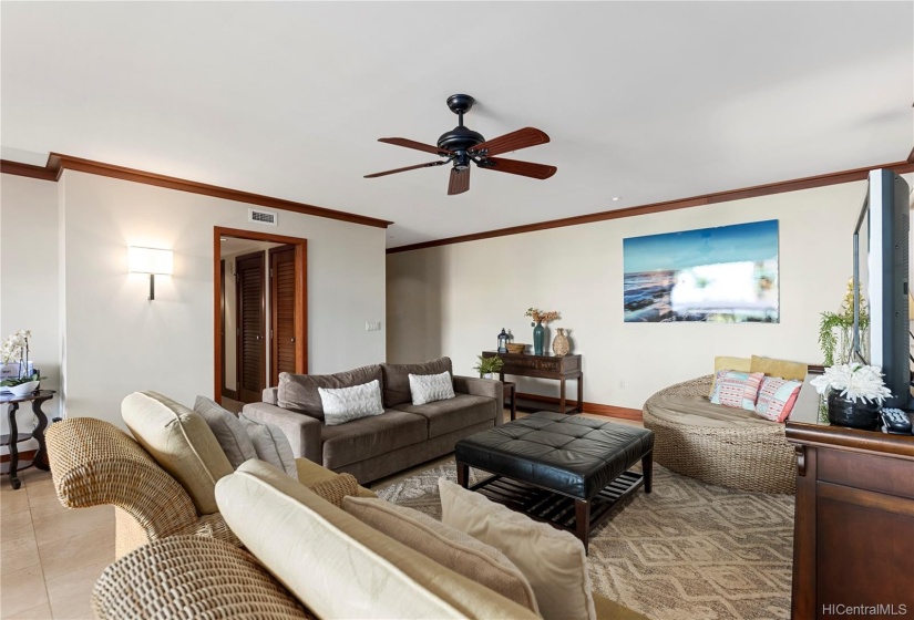 Living room area with flat screen TV and plenty of comfortable seating options