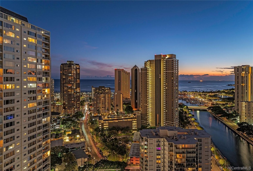 Once night falls the city sparkles. Beautiful view of the canal and harbor.