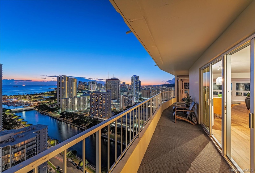 As the Honolulu sun sets, the city comes to life.  Enjoy this 740 sq ft lanai that practically wraps around the living area providing a stunning view.  The perfect place to watch the 4th of July fireworks.