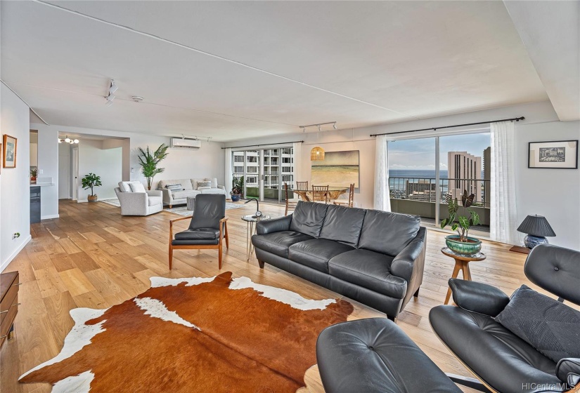 Unwind in this spacious open style living area.  New split AC, recently painted, two sliding doors, a pocket door and a wall of windows surround this corner end unit on the Penthouse 30th floor unit. Comfortable and modern.