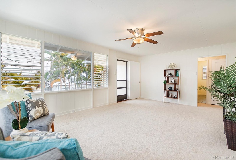 Spacious living area with brand new carpets.