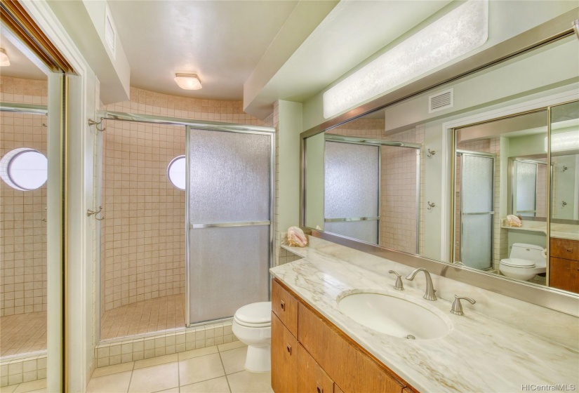 The bathroom features a large closet and vanity