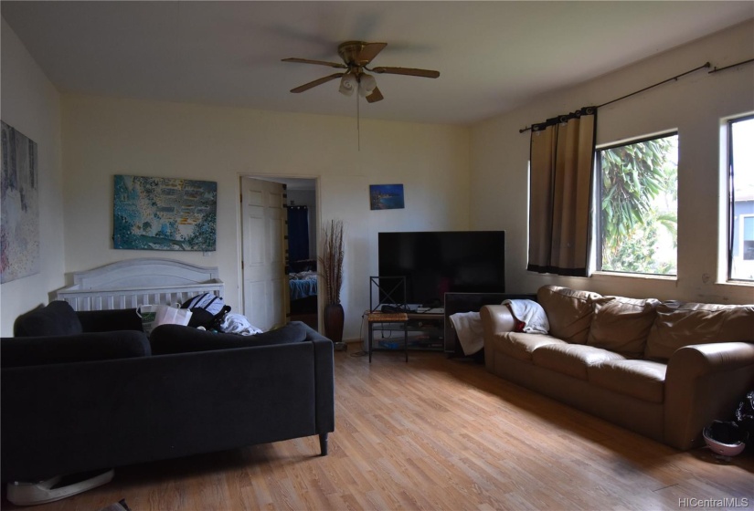 Livingroom, facing front entry and kitchen