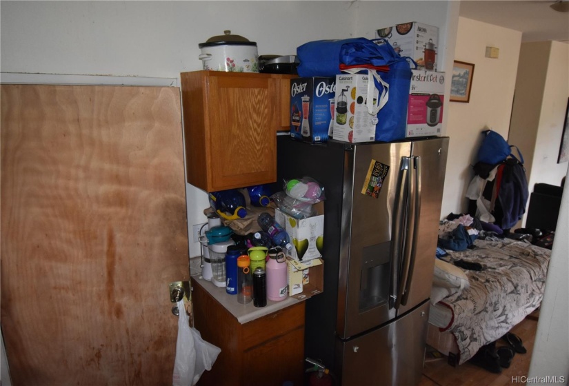 Kitchen, facing garage door and livingroom/hall to bedrooms