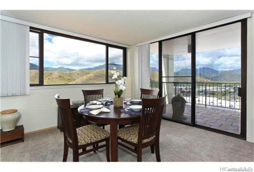 Open dining space featuring glass windows and doors to enjoy the breathtaking views of East O'ahu. Please note: unit is currently Tenant occupied.