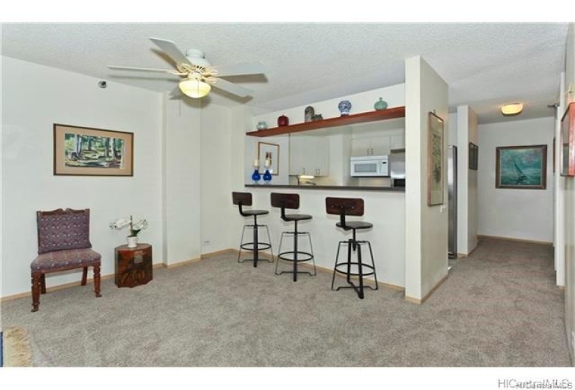 Kitchen features a bar seating area that flows into the living space. Please note: unit is currently Tenant occupied.