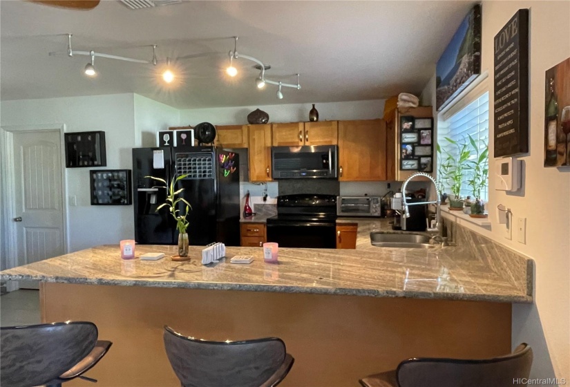 Kitchen with granite counters and appliances 1 year young