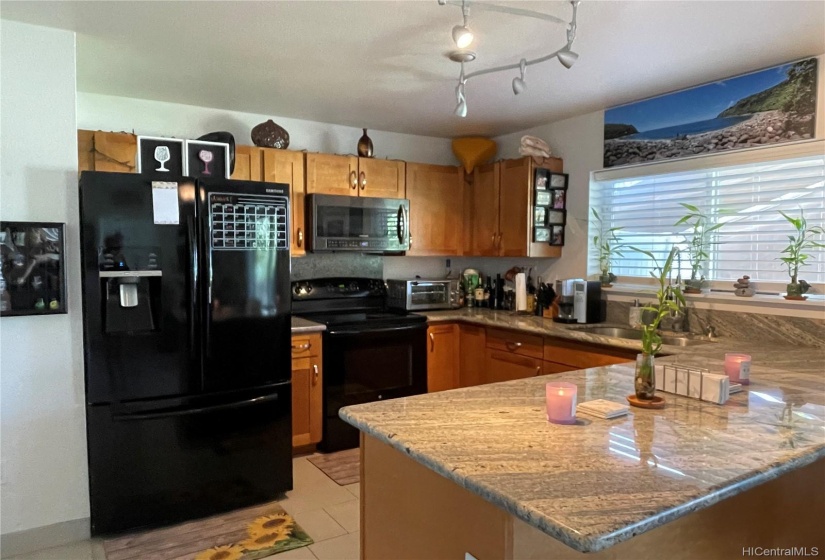 Kitchen with porcelain flooring throughout downstairs