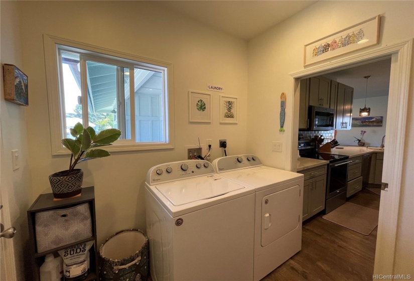 Laundry room off of kitchen & next to garage