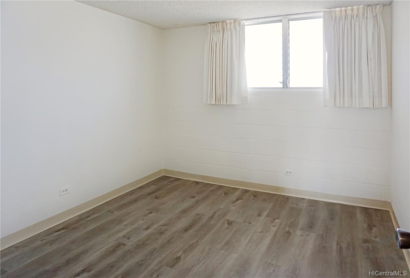 Bedroom with new Vinyl Plank flooring