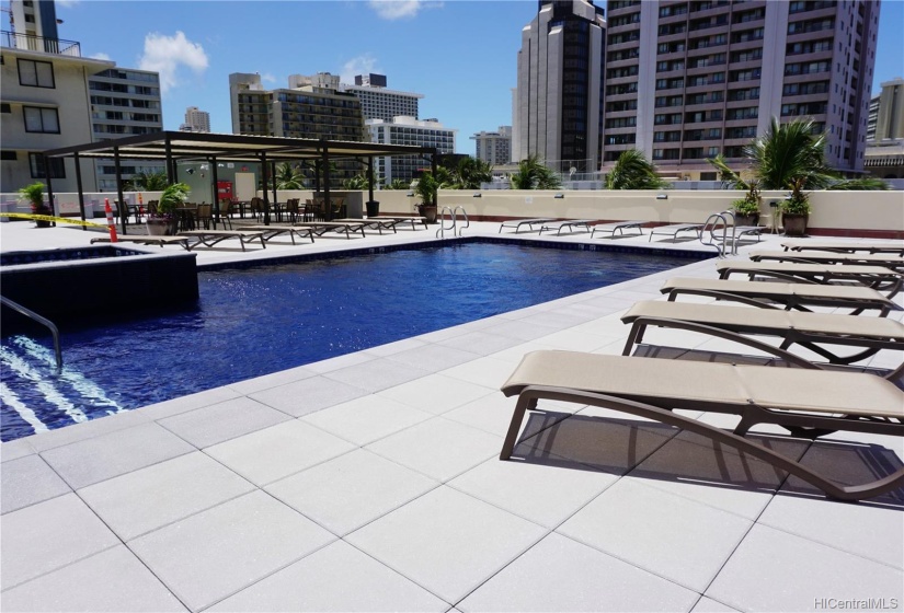 Beautiful new swimming pool deck with seating areas to enjoy